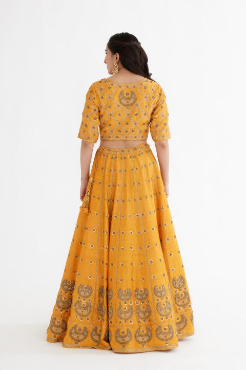 Ochre Yellow Lehenga Paired with Blouse and Cream Dupatta