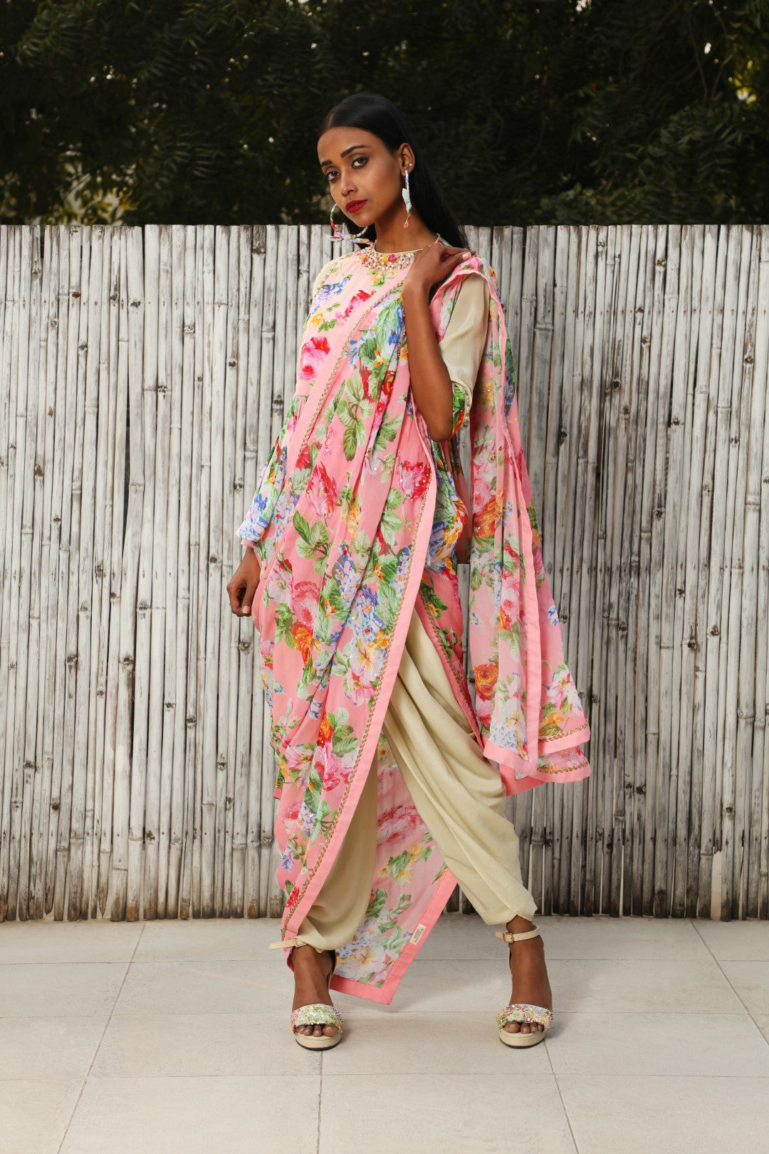 Antique jade georgette dhoti saree teamed with a soft pink VR panel top.