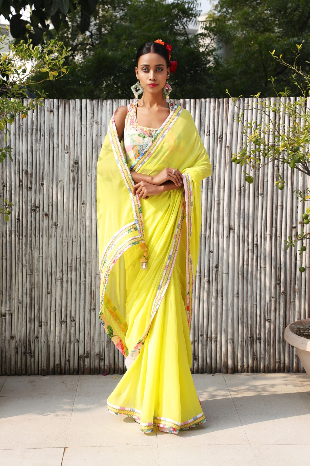 Plain limegreen georgette saree with vintage rose and checks border.