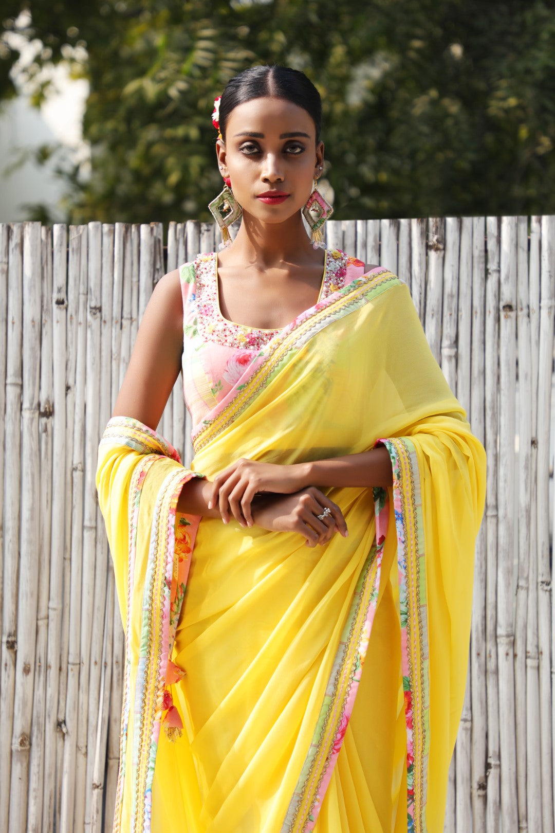 Plain pitambri yellow georgette saree with vintage rose and checks border.