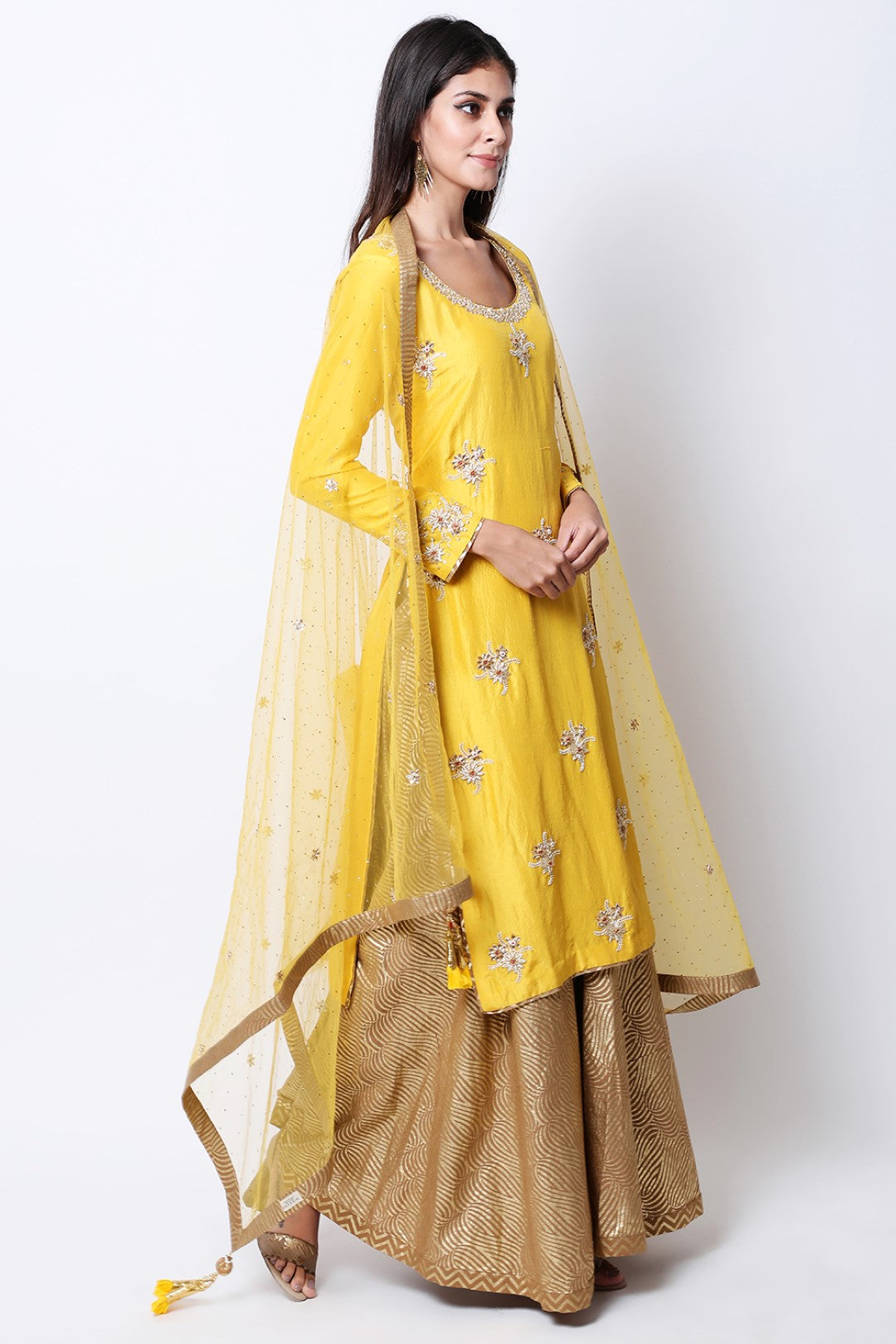 yellow silk kurta with mukesh embellished dupatta and tabacco swirl gold printed wide leg pants.