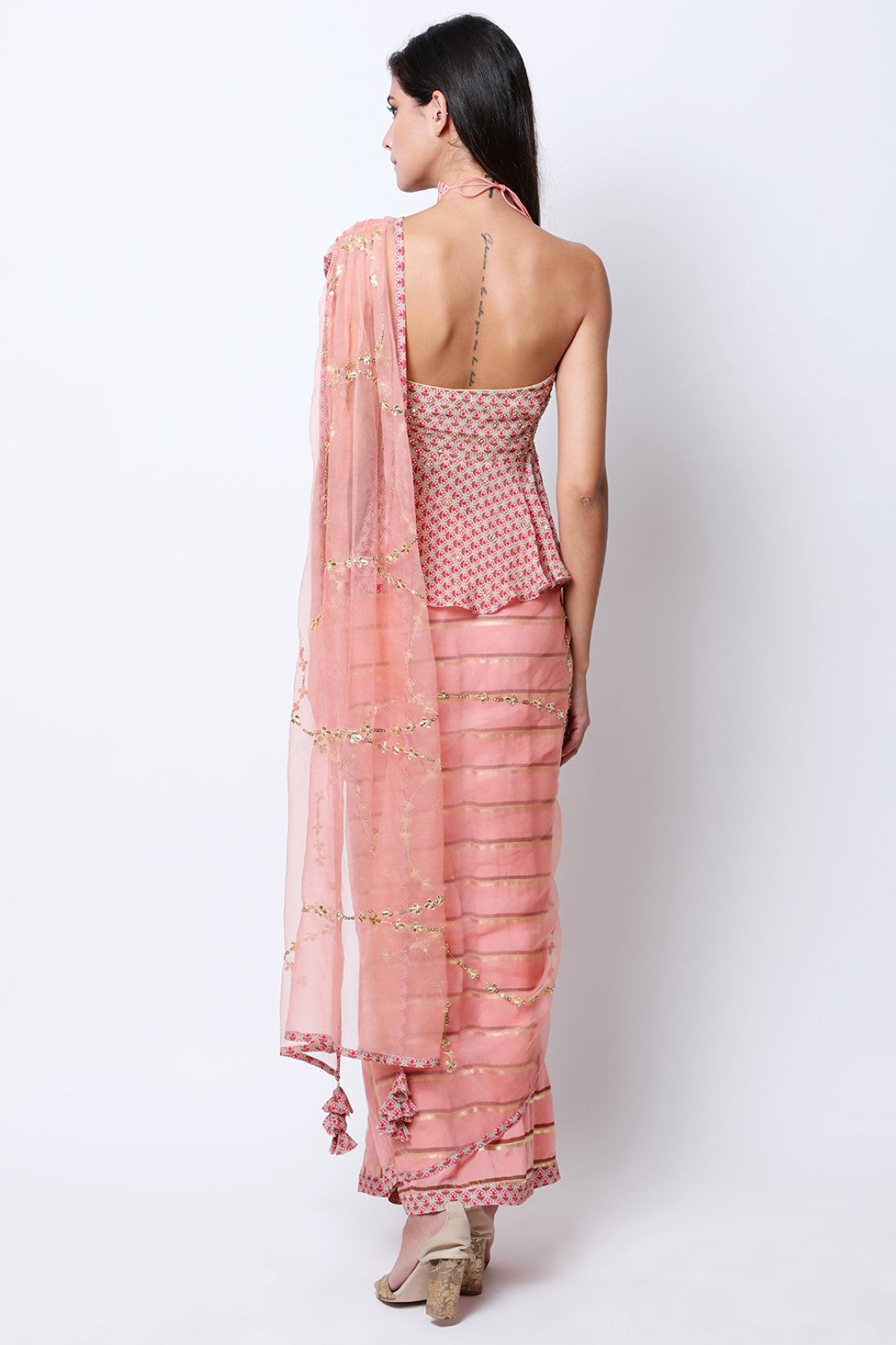 Vintage rose leheriya pre-pleated crepe saree with embroidered drape and peplum embroidered blouse.