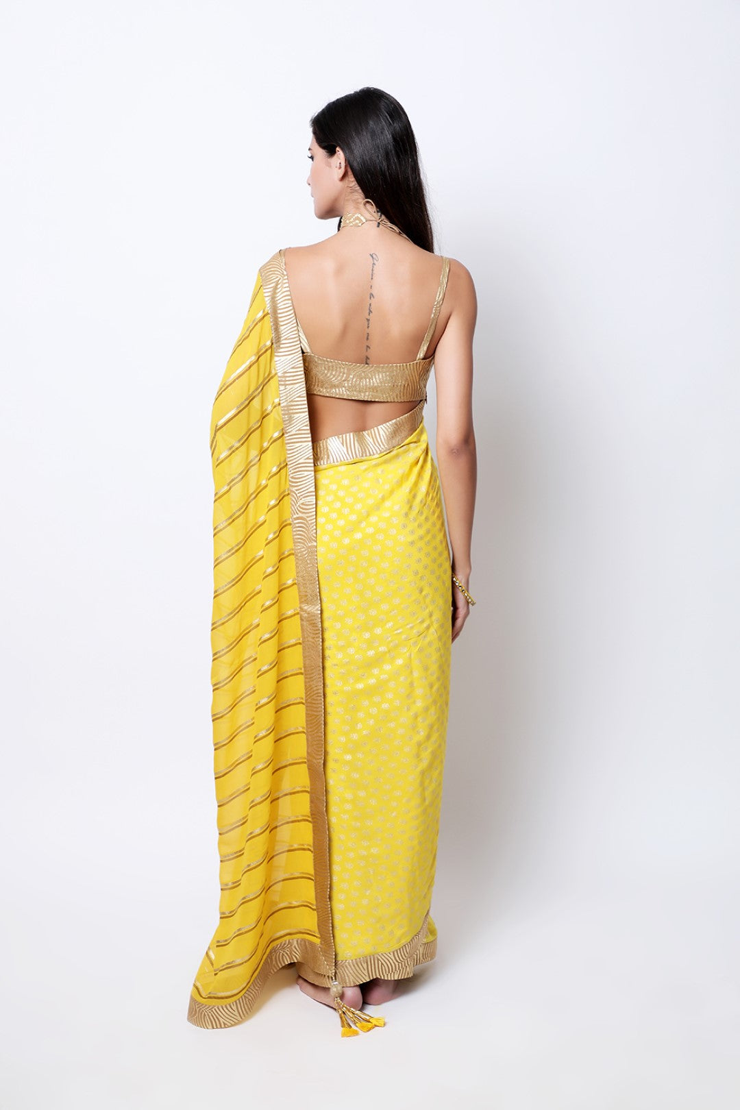 Pitambari Yellow leheriya crepe palla with jaipuri guldasta pleated saree , paired with tabacco swirl strap blouse.