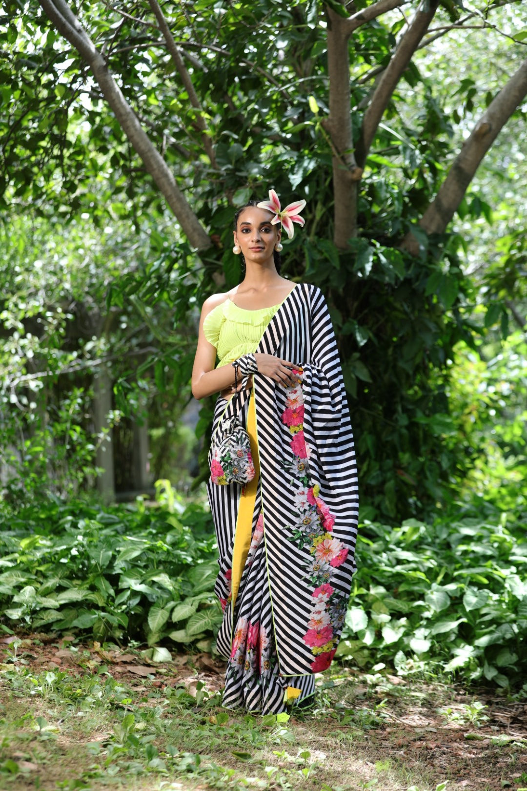 Black/white lehariya crepe saree with lime green unstitched blouse fabric