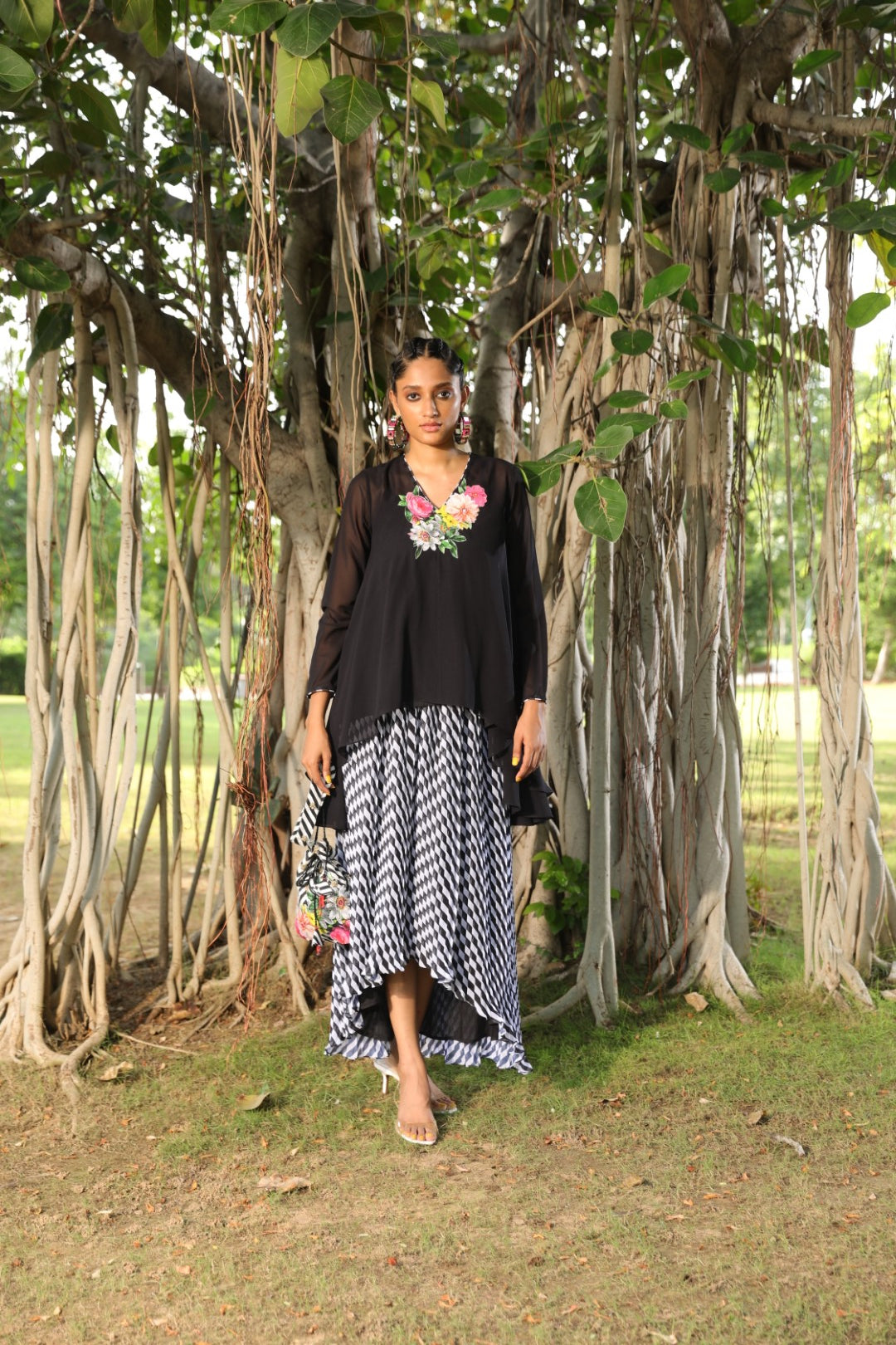 Black georgette tunic paired with pleated lehraiya skirt