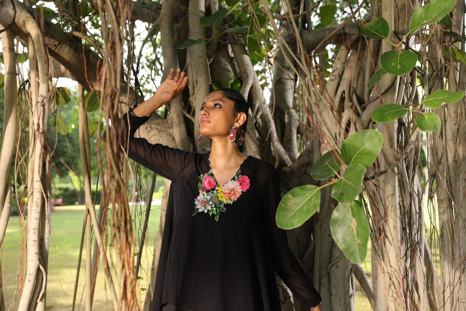 Black georgette tunic paired with pleated lehraiya skirt