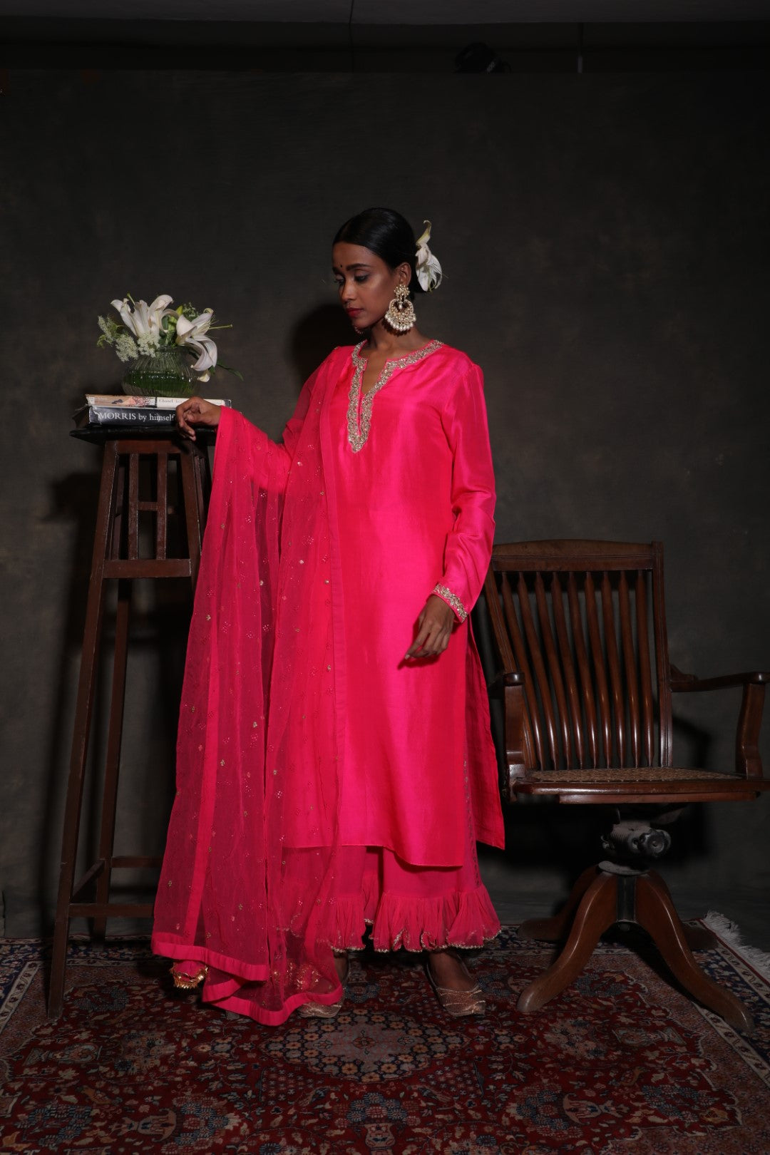 Rani pink silk kurta with a rani pink cropped frills pants and dupatta