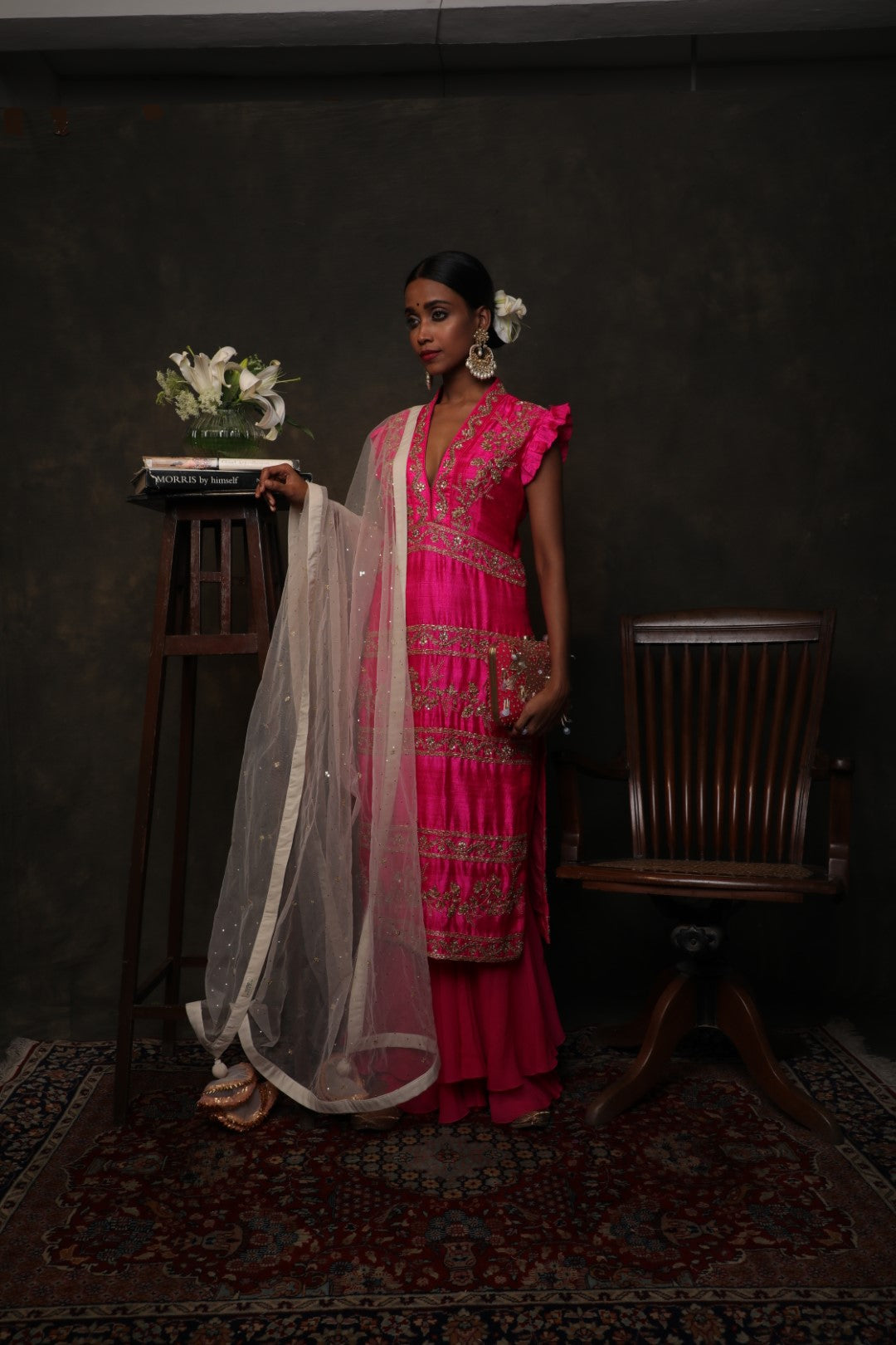 Rani pink raw silk kurta with a double layered sharara and dupatta