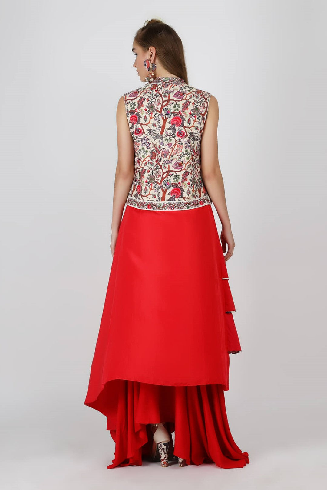 sleeveless jacket paired with red tier tunic with ryon moss skirt.