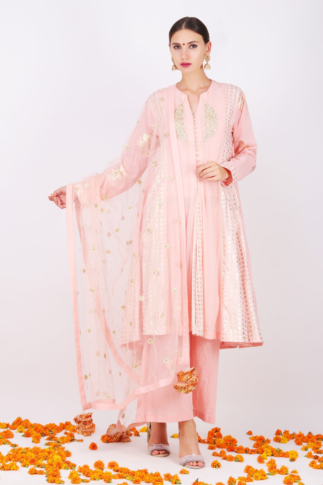 Rose pink kalis kurta with rose pink  mukesh net embroidered dupatta and salmon cotton pleated pant.