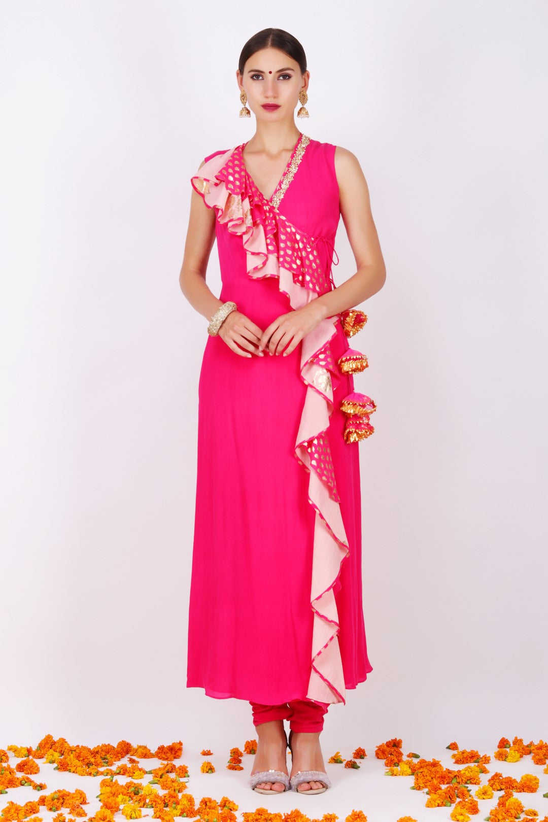 Rani pink crepe wrap tunic with rani pink churidar.