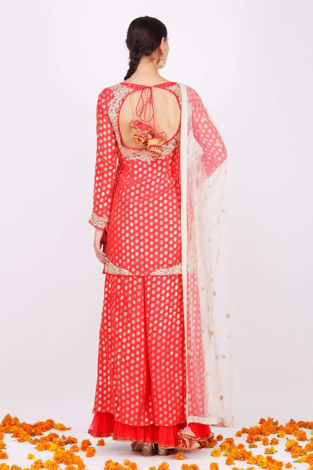 Gajari crepe lotus foil printed short kurta with crepe lotus foil printed wide leg pant and ghee mukesh net embroidered dupatta.