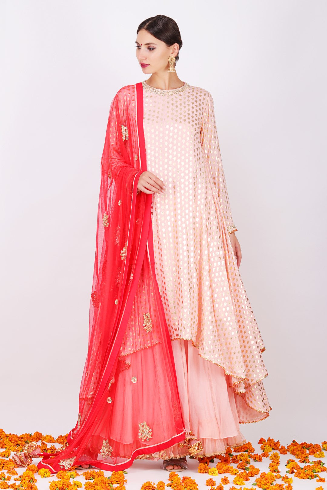 Rose pink crepe foil printed asymmetrical tunic with sharara and gajari net embroidered dupatta.