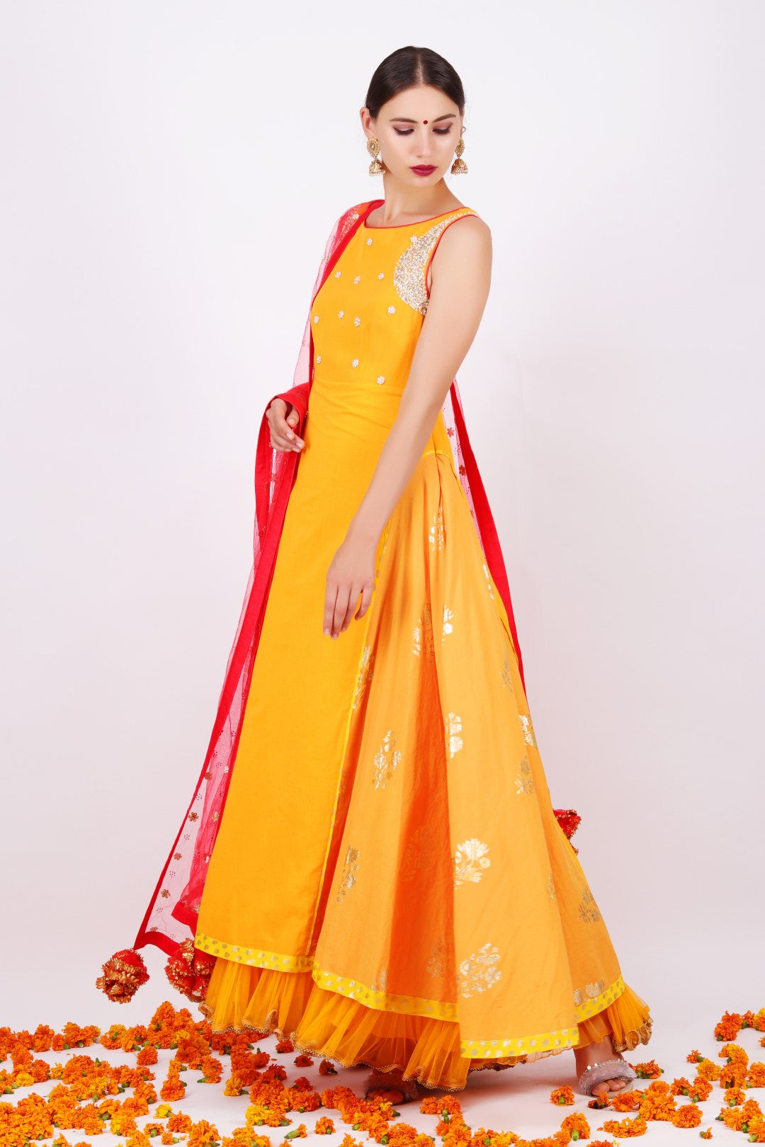 Haldi embroidered yoke kalidar with gajari net embroidered dupatta and churidar.