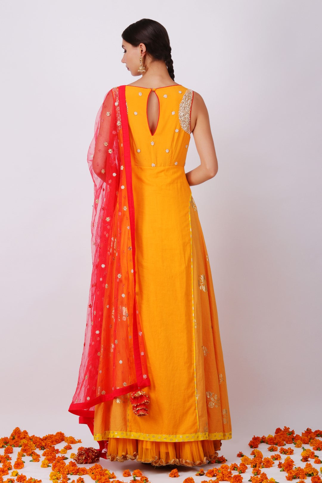 Haldi embroidered yoke kalidar with gajari net embroidered dupatta and churidar.