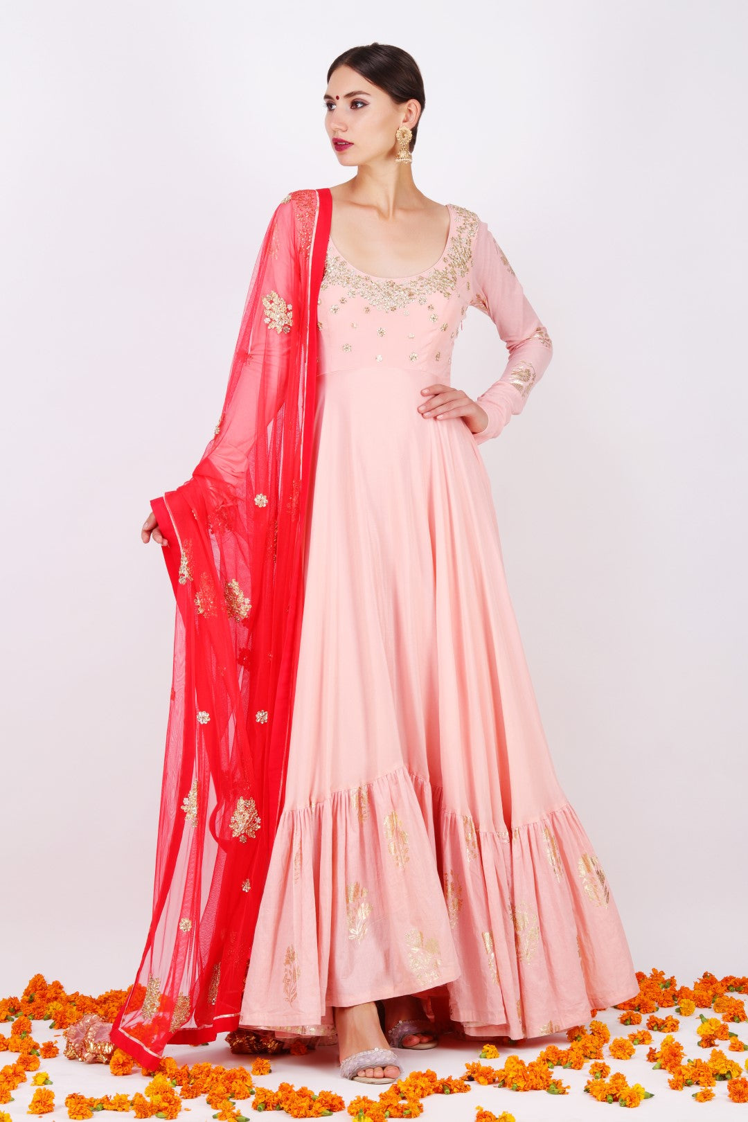 Dusky salmon Crepe kalidar with net embroidered gajari dupatta.