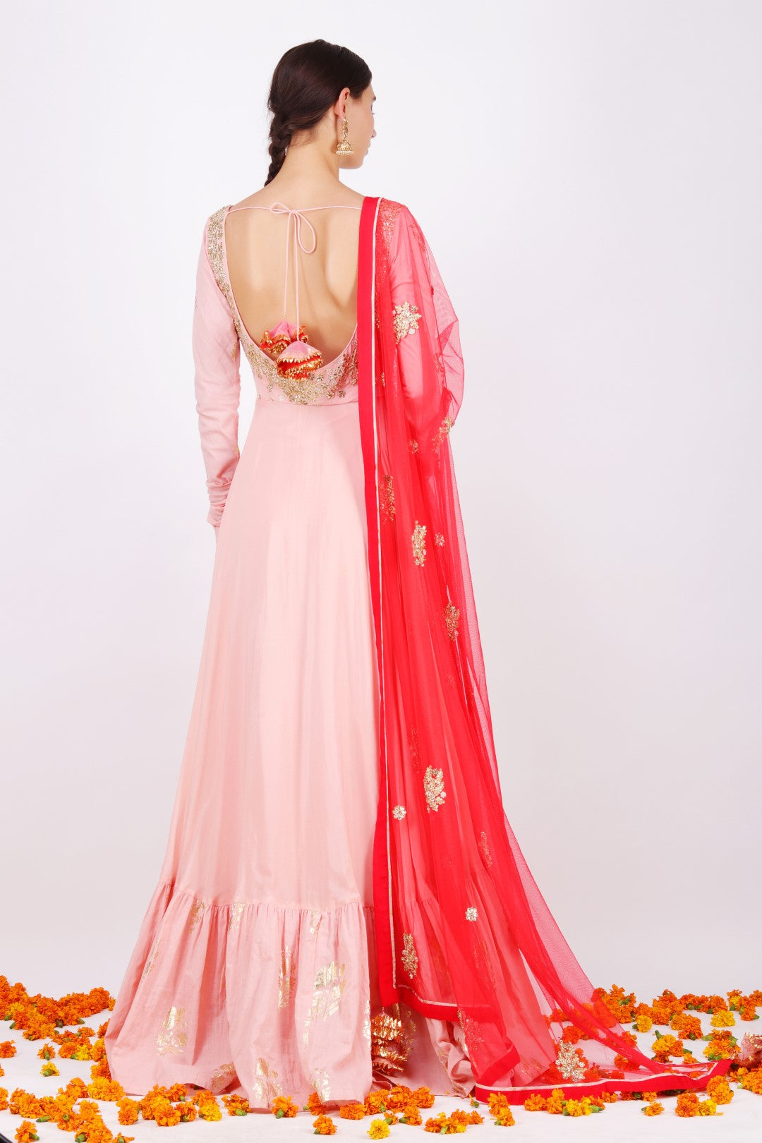 Dusky salmon Crepe kalidar with net embroidered gajari dupatta.