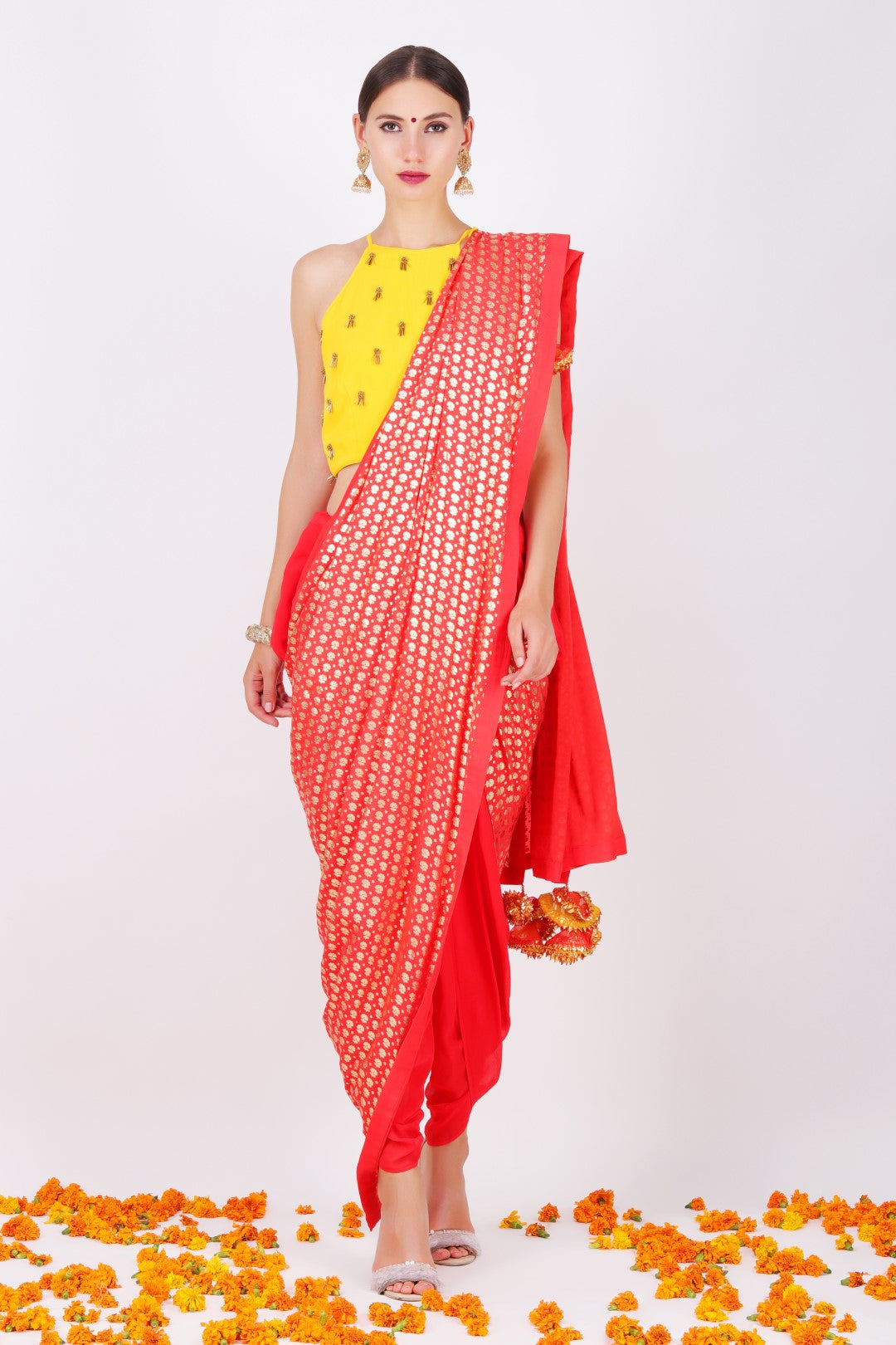 Yellow crep halter crop top with gajari georgette cowl dhoti saree.