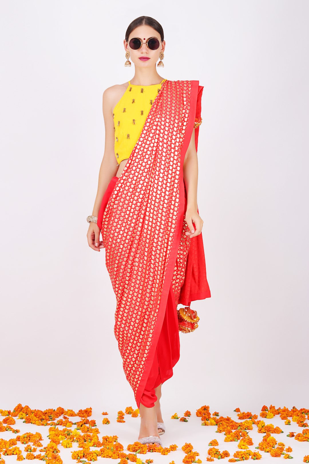 Yellow crep halter crop top with gajari georgette cowl dhoti saree.