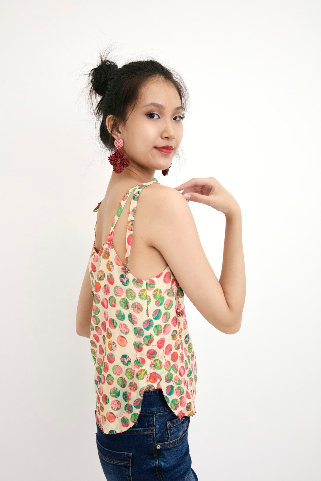 "Handwove cream hand-painted polka dot printed camisole in handwoven cotton silk, embellished with french knots and sequins. 100% Handwoven cotton silk; Lining: 100% cotton 100% Azo Free Dry Clean Only"