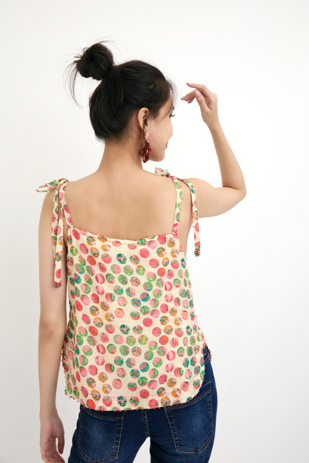 "Handwove cream hand-painted polka dot printed camisole in handwoven cotton silk, embellished with french knots and sequins. 100% Handwoven cotton silk; Lining: 100% cotton 100% Azo Free Dry Clean Only"