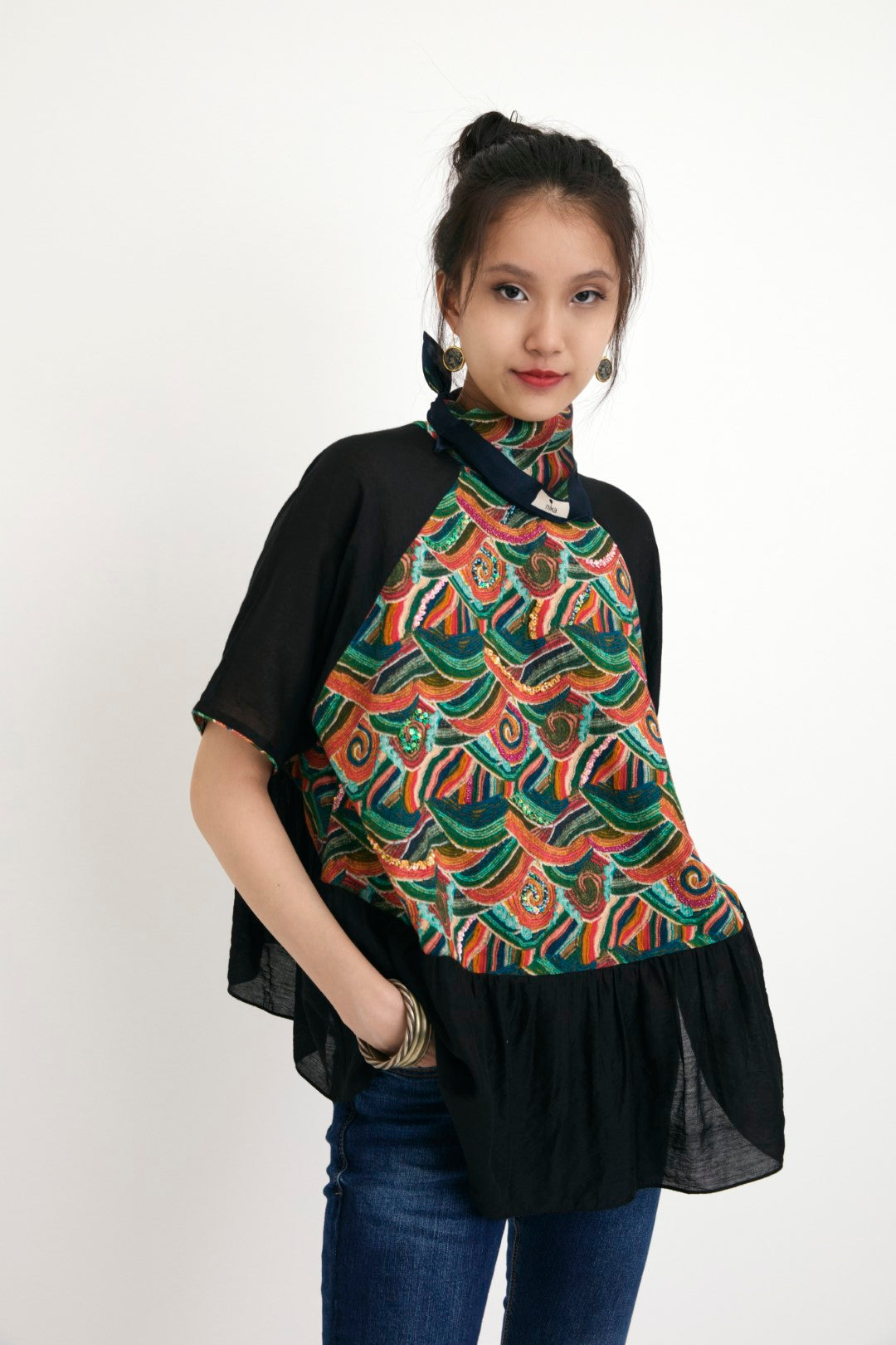 "Handpainted iconic ocean wave print body with solid black color sleeve & frill top embellished with hand embroidery in multi-colors sequins and beads. 100% Handwoven silk; Lining: 100% cotton 100% cotton Azo free"