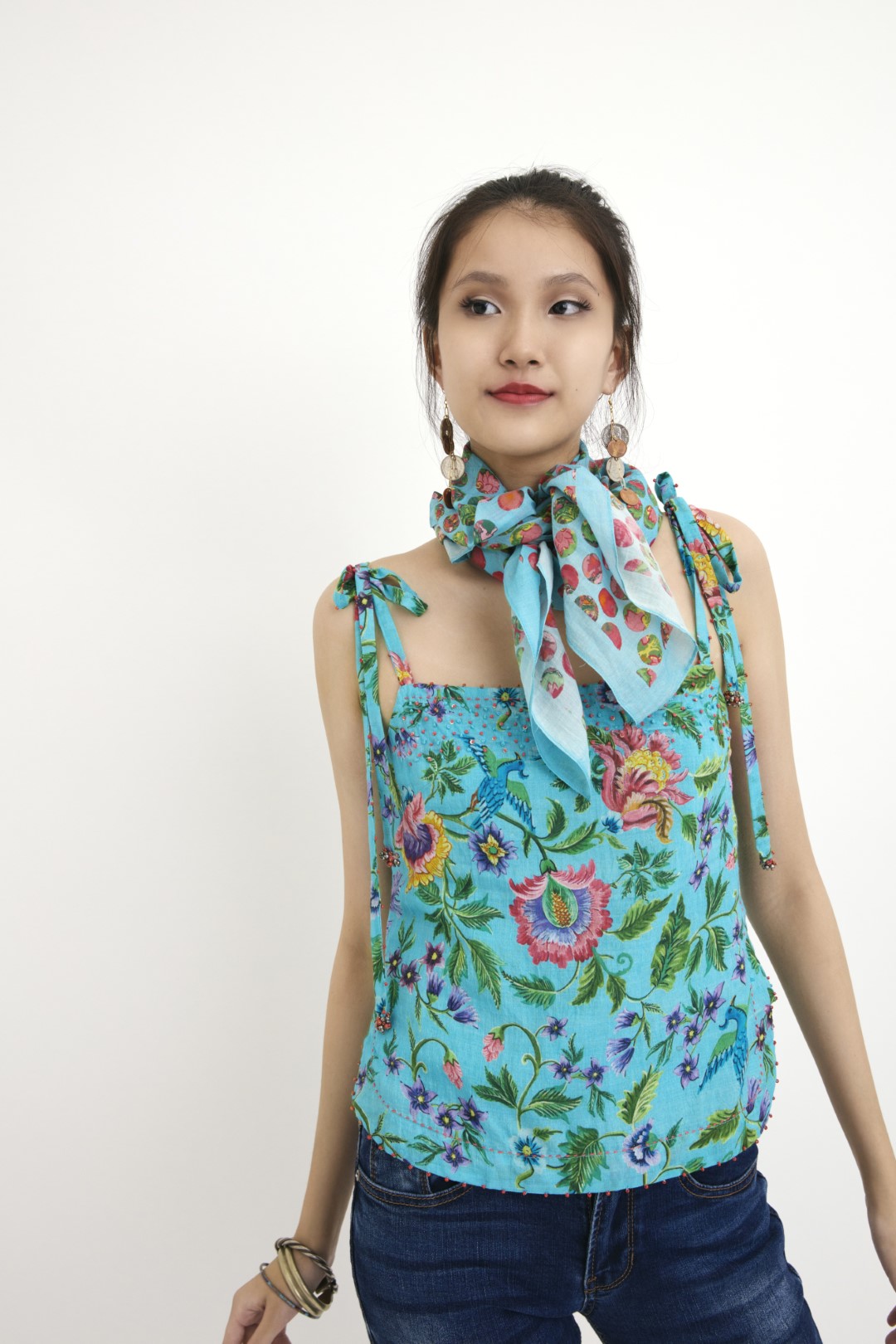 "Handwoven blue hand-painted chintz printed camisole in handwoven silk cotton, embellished with french knots and sequins. 100% Handwoven cotton silk; Lining:100% cotton 100% Azo Free Dry Clean Only"