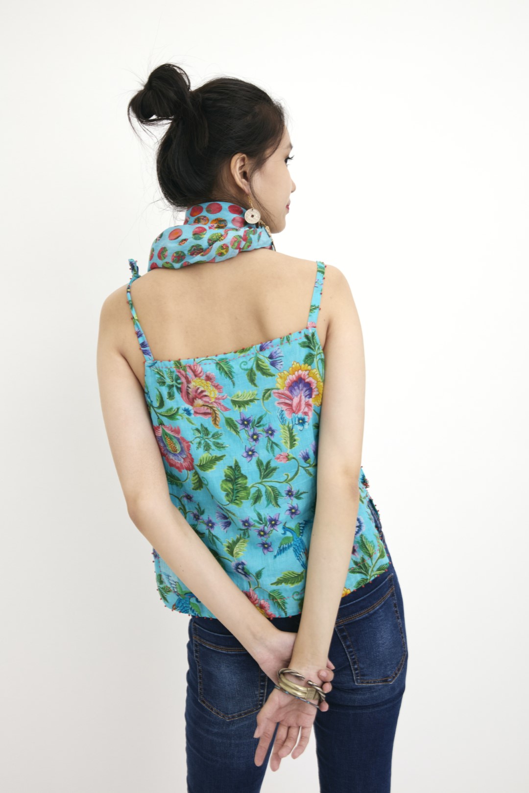 "Handwoven blue hand-painted chintz printed camisole in handwoven silk cotton, embellished with french knots and sequins. 100% Handwoven cotton silk; Lining:100% cotton 100% Azo Free Dry Clean Only"