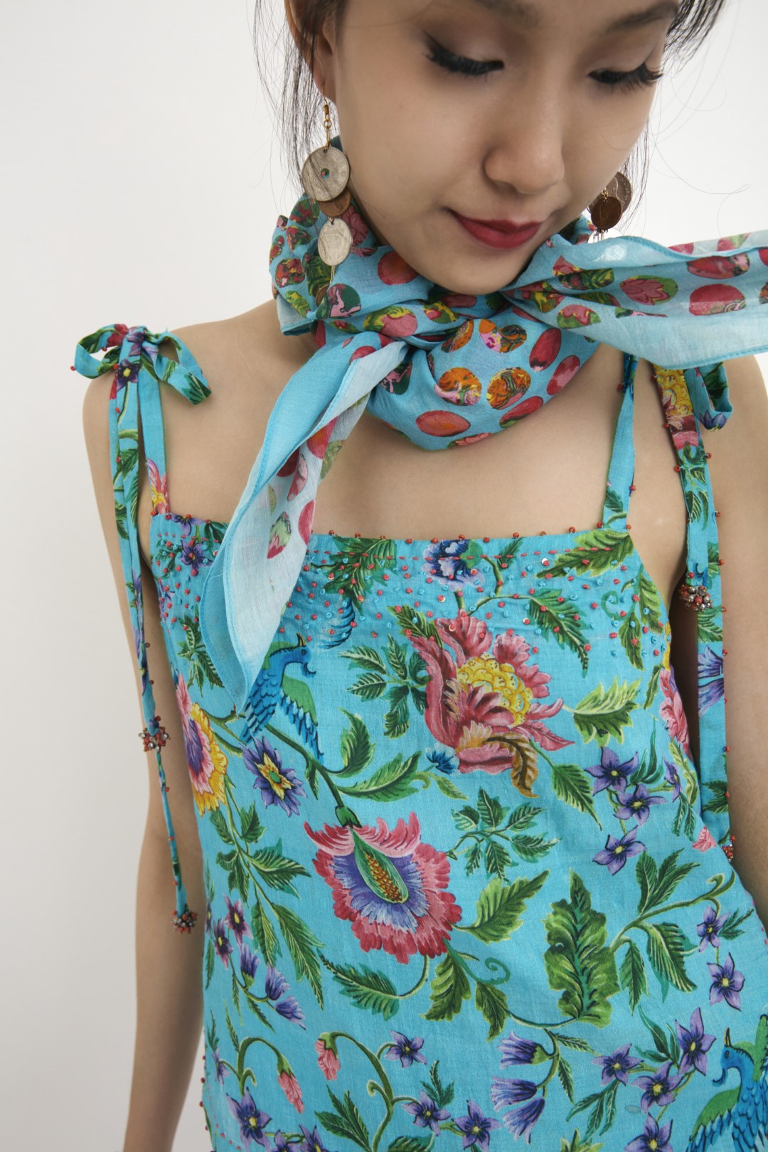 "Handwoven blue hand-painted chintz printed camisole in handwoven silk cotton, embellished with french knots and sequins. 100% Handwoven cotton silk; Lining:100% cotton 100% Azo Free Dry Clean Only"