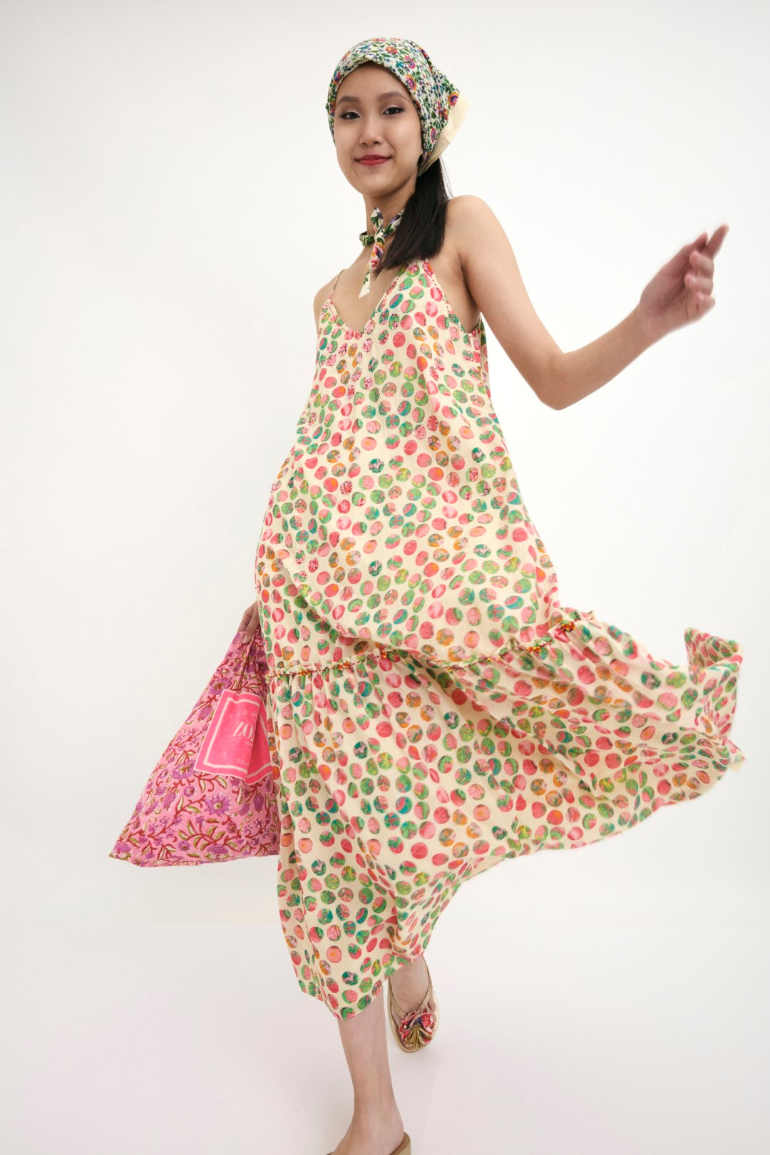 "Handwoven cotton silk polka dot strap dress with pink shaded sequence & hand embroidery detail. 100% Handwoven cotton silk; Lining: 100% cotton 100% Azo Free Dry Clean Only"