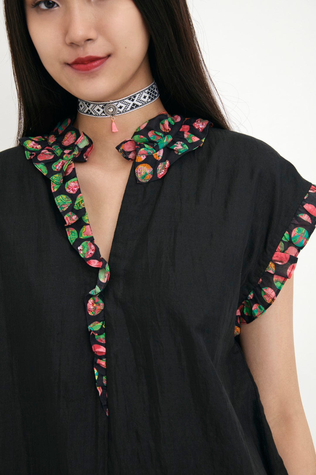 "Handwoven solid cotton silk black tunic with polka dot in frill detail and hand embroidery in sequins detail.  100% Handwoven cotton silk 100%  Azo free"