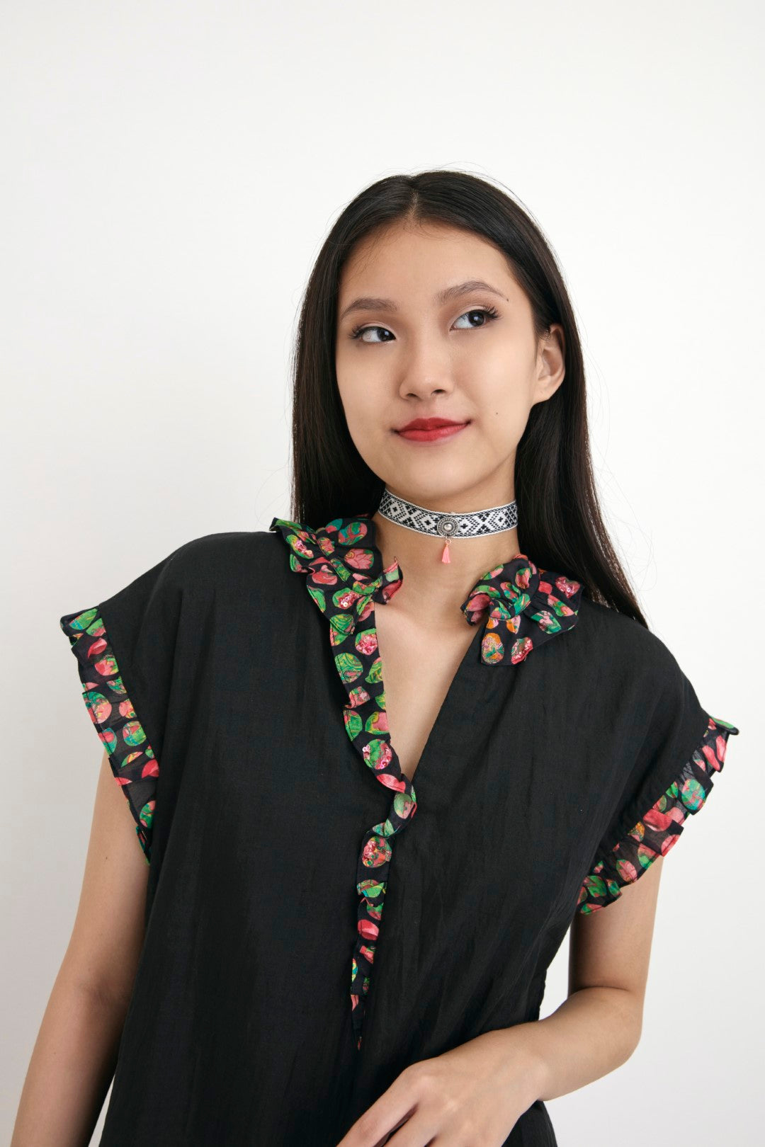 "Handwoven solid cotton silk black tunic with polka dot in frill detail and hand embroidery in sequins detail.  100% Handwoven cotton silk 100%  Azo free"