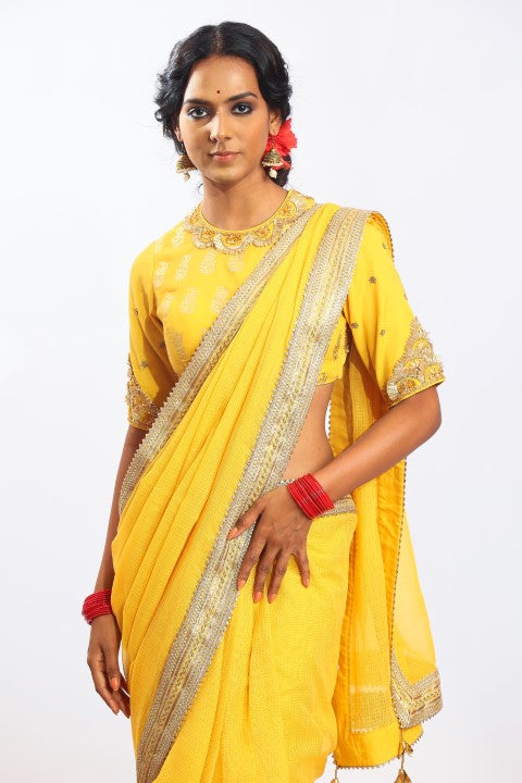 PITAMBARI YELLOW KOTA DORIA SAREE PAIRED WITH MATCHING SIGNATURE MUGHAL BUTA PRINT BLOUSE.