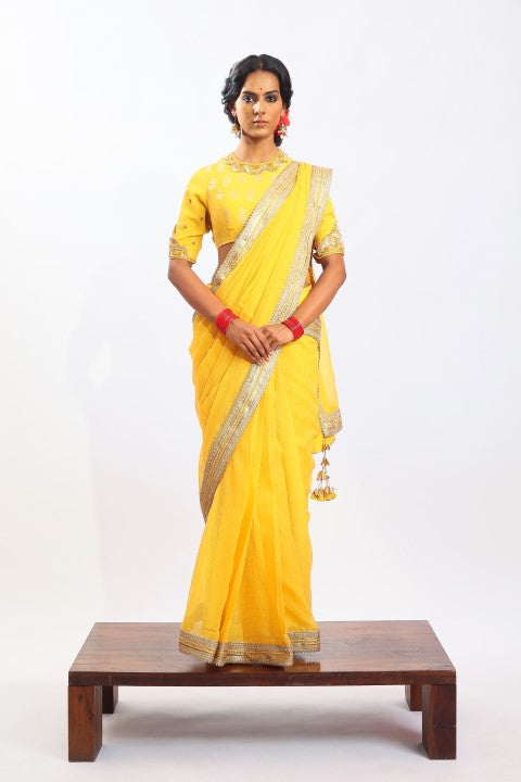 PITAMBARI YELLOW KOTA DORIA SAREE PAIRED WITH MATCHING SIGNATURE MUGHAL BUTA PRINT BLOUSE.