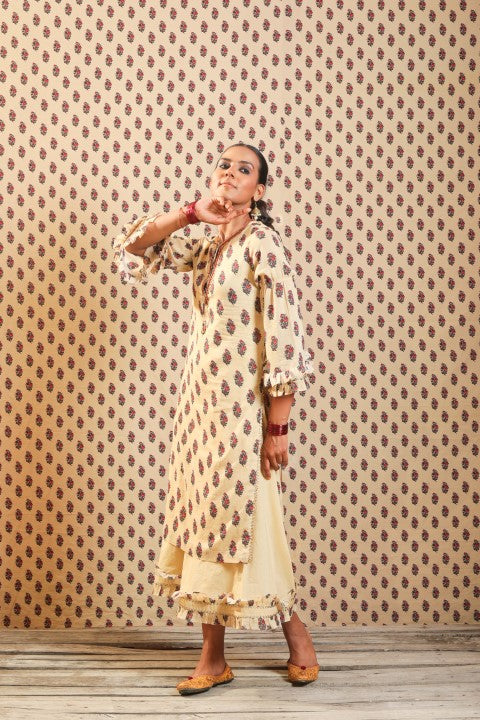 BEIGE SOFT COTTON KURTA PAIRED WITH WIDTH LENGTH PANTS.