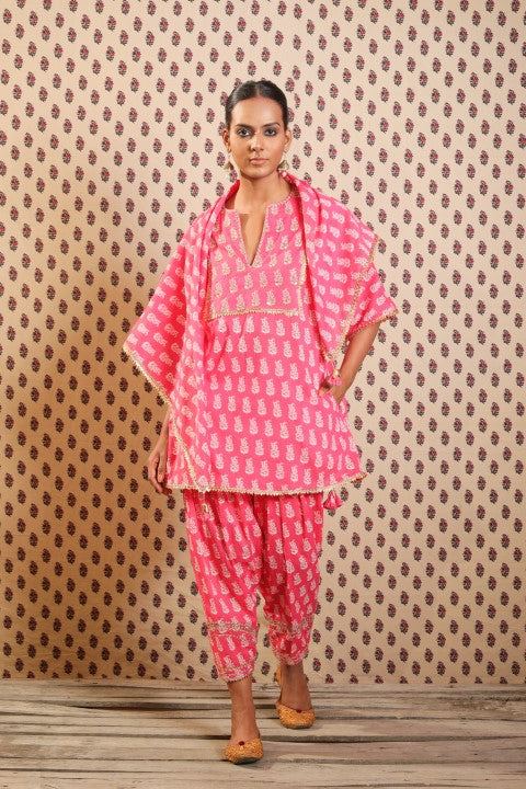 MITHAI PINK KURTA PAIRED WITH SALWAR AND A PRINTED SCARF.