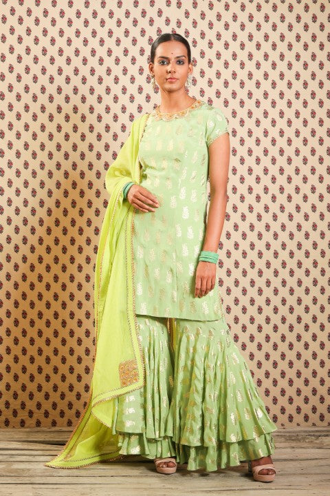 PISTA GREEN ANGRAKHA PAIRED WITH DOUBLE LAYERED SHARARA AND HANDWOVEN KOTA DORIA DUPATTA.