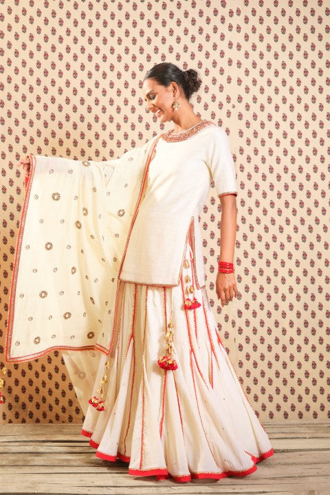 IVORY RAW SILK SHORT KURTA PAIRED WITH HAND CRUSHED COTTON LEHENGA AND IVORY HANDWOVEN JAMDANI DUPATTA.