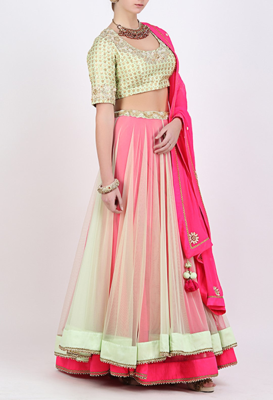 PISTA AND PINK DOUBLE LAYERED LEHENGA WITH EMBROIDERED BLOUSE AND DUPATTA.