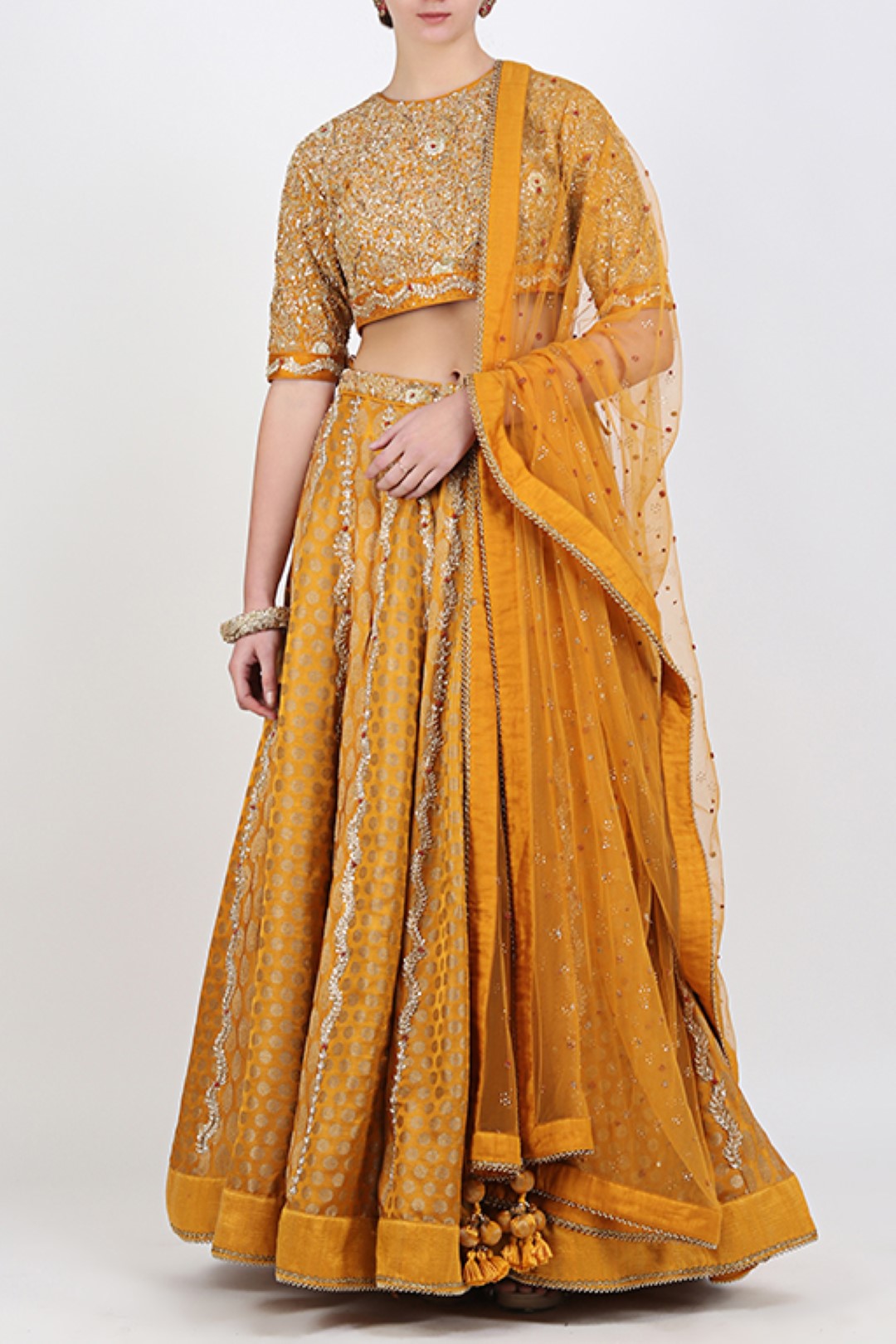 OCHRE BLOUSE WITH OCHRE BROCADE EMBROIDERED LEHENGA WITH EMBROIDERED DUPATTA.