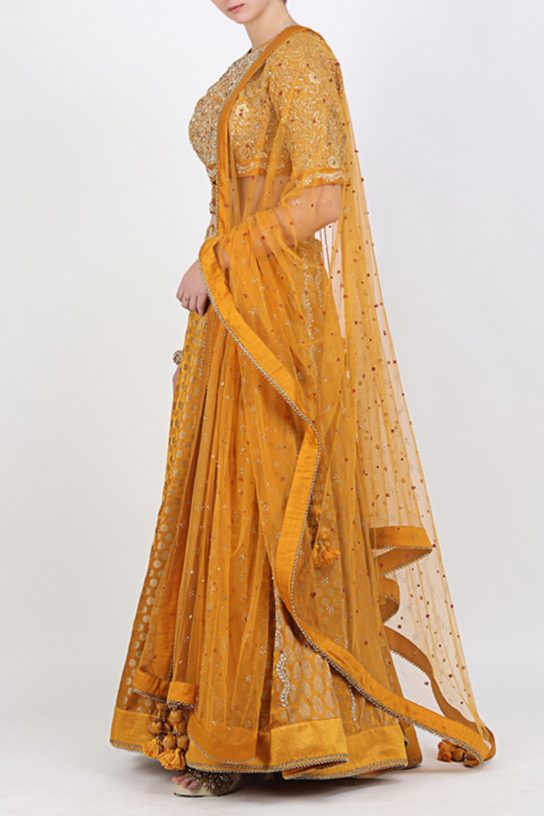 OCHRE BLOUSE WITH OCHRE BROCADE EMBROIDERED LEHENGA WITH EMBROIDERED DUPATTA.