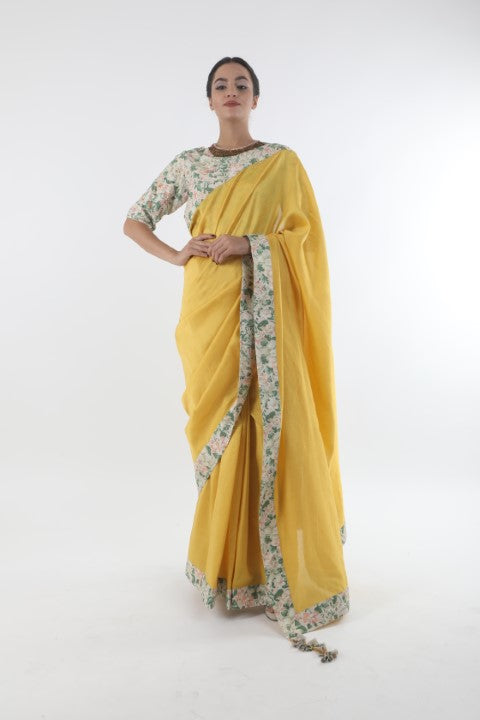 Bloom pitambari yellow chanderi saree in bibi jaal printed border with printed & organza embroidered  cotton blouse.