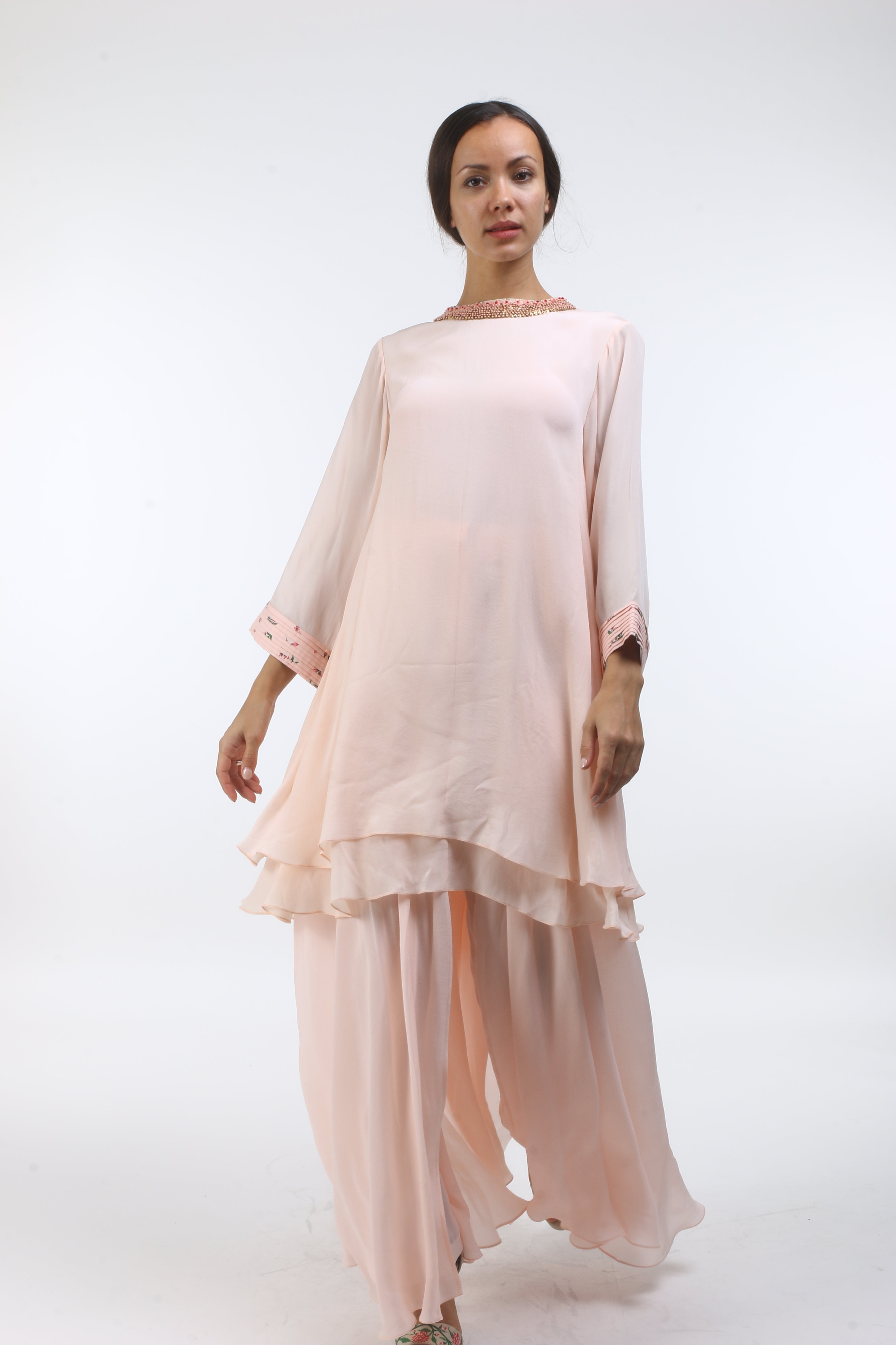Bloom salmon pink layered tunic with bouquet printed pintuck cuff and french knot embroidered neckline, paired with a front open sharara.