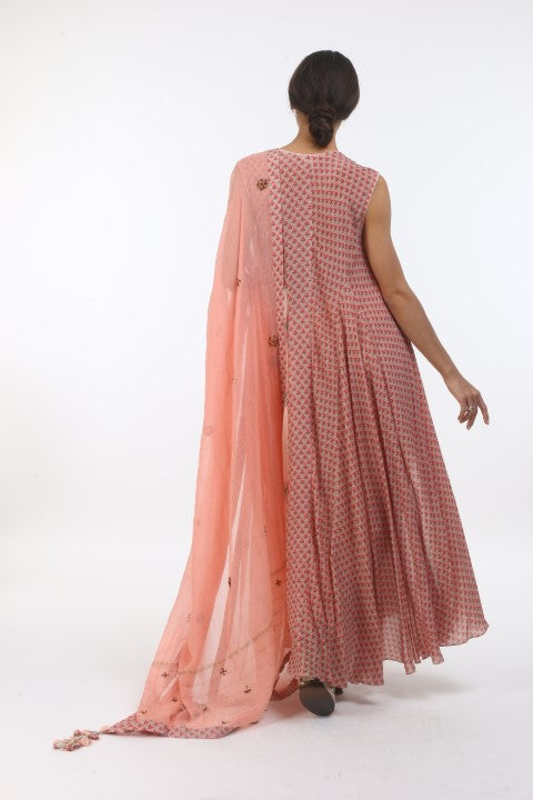 Bloom salmon pink new sanga printed kurtha in hibiscus godet & floral organza embroidered neckline, with churidar and printed & embroidered dupatta.