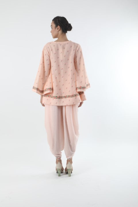 Bloom salmon pink bell sleeve top in taj and mumtaz bel print details.