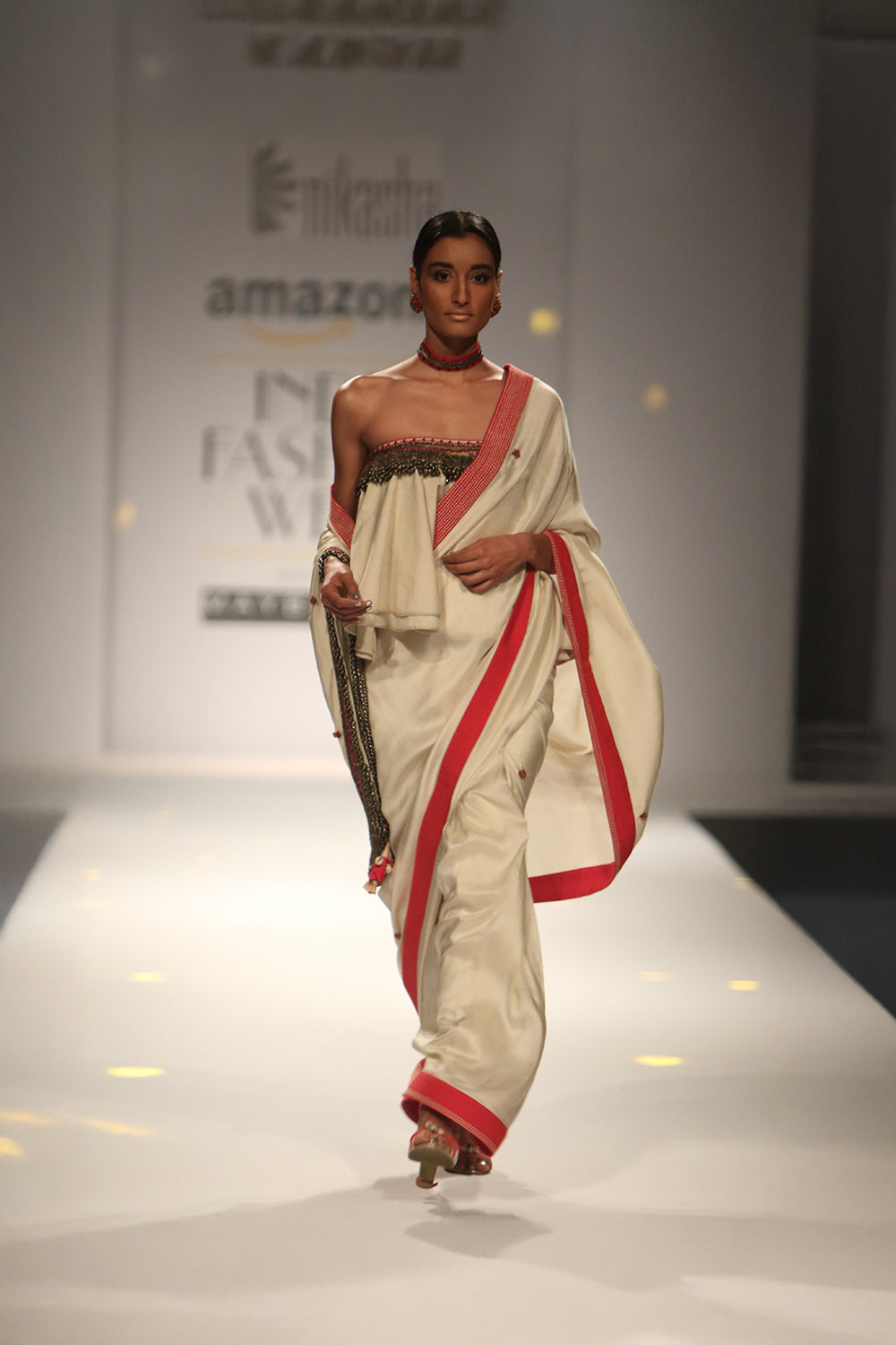 Sonam Kapoor in Ivory Crepe Silk Saree with Ruffled Off-Shoulder Blouse