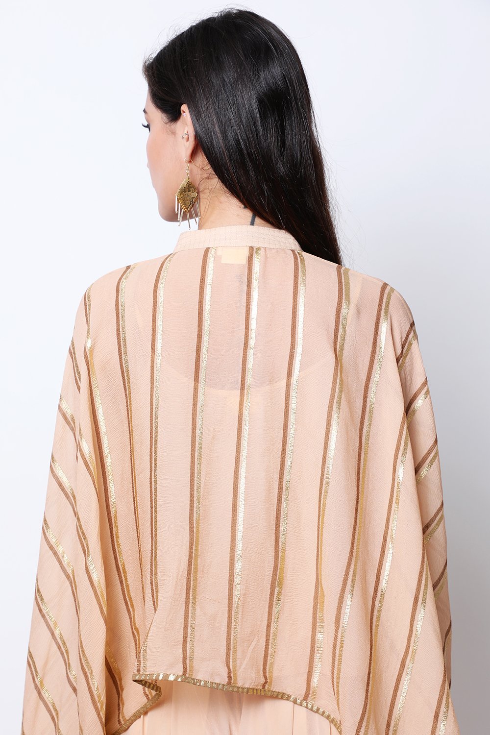 Light Tabacco leheriya cape , paired with crop top and cowl dhoti.