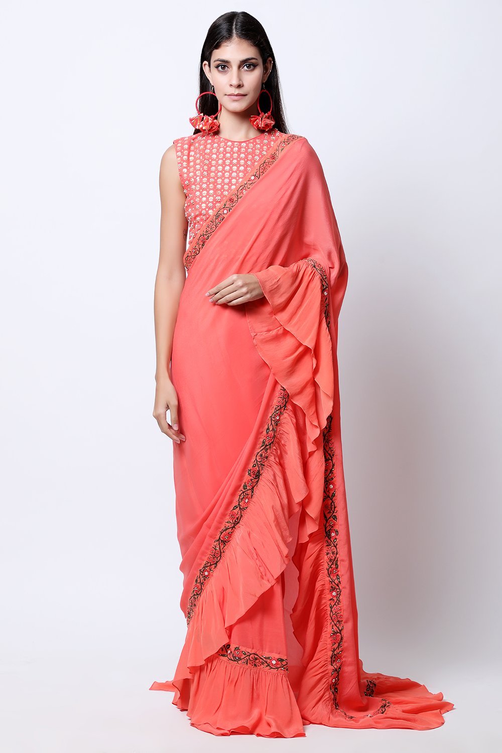 Gajari Coral frill saree with bel detail , paired with chotu sanga gold printed hand-embroidered blouse.
