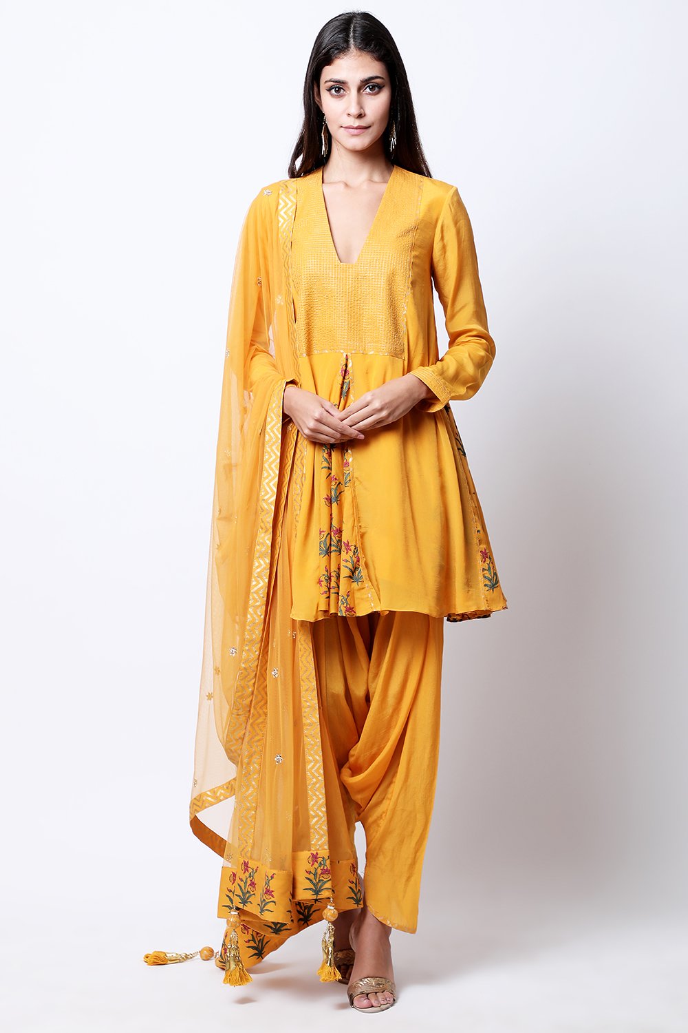 Ochre hand printed front and side godets kurta with mukesh embroidered dupatta and cowl dhoti.
