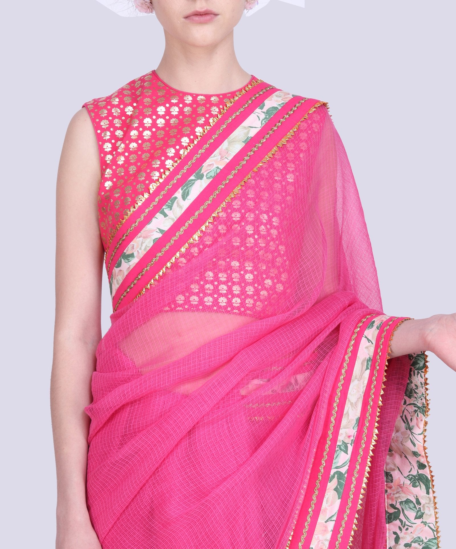 Hot pink pink kota doria saree gota border with a gold foil printed blouse .